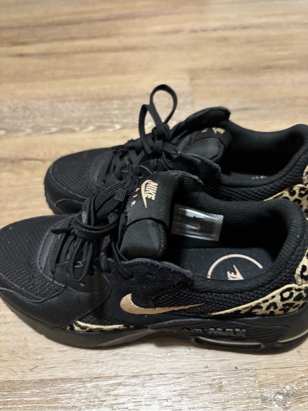Nike Women’s Black Sneakers with Gold Swoosh and Leopard Trim